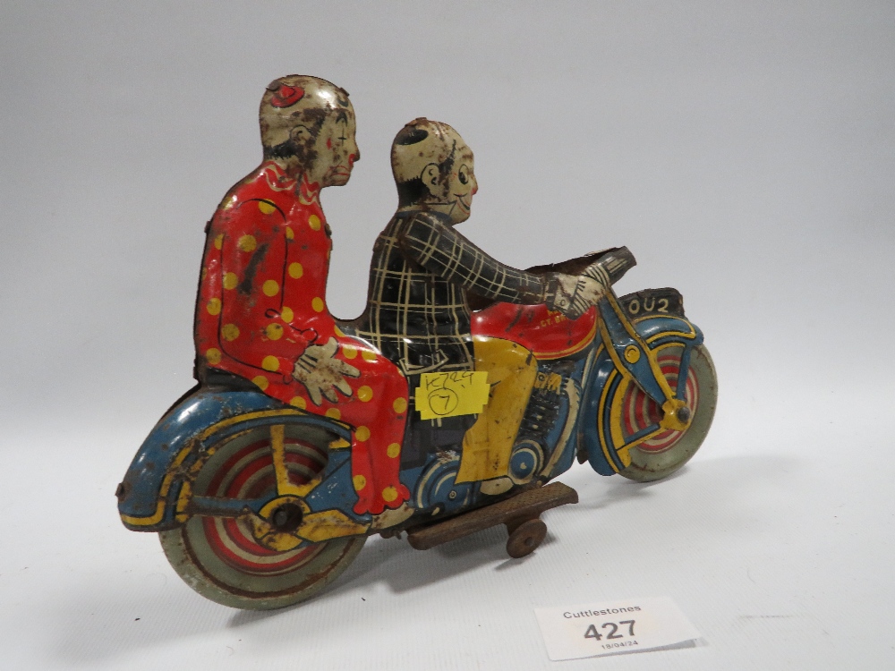 AN EARLY 20TH CENTURY METTOY CLOCKWORK TINPLATE MOTORCYCLE WITH RIDER AND PASSENGER - Image 3 of 3
