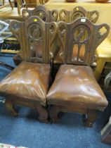 A SET OF FOUR ANTIQUE CARVED OAK CHURCH STYLE CHAIRS