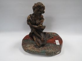 AN EBANO BRONZED SCULPTURE FROM THE VIDAL COLLECTION DEPICTING A KNEELING SEMI NUDE GIRL, raised