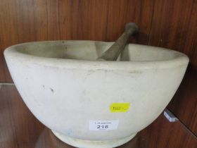 A LARGE PESTLE AND MORTAR