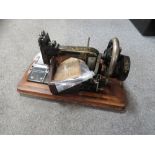 A VINTAGE CASED FRISTER & ROSSMANN'S GERMAN SEWING MACHINE PLUS ACCESSORIES