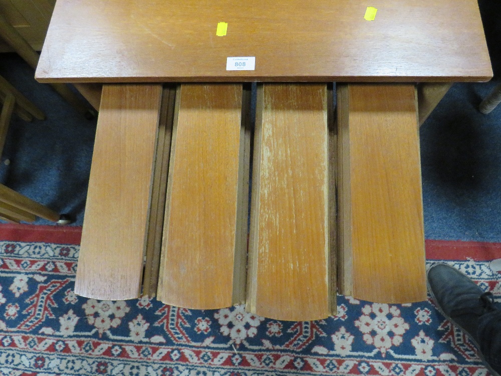 A MID CENTURY TEAK NEST OF TABLES ON CASTORS - Image 2 of 2