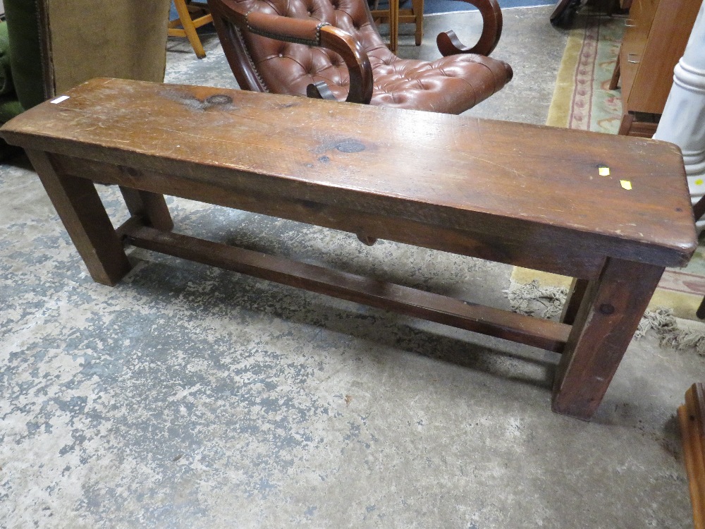 A RUSTIC STYLE WOODEN BENCH