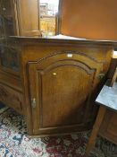 AN ANTIQUE LARGE OAK HANGING CORNER CUPBOARD