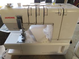 A JANOME COVER PRO 2000CPX SEWING MACHINE