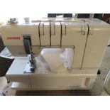 A JANOME COVER PRO 2000CPX SEWING MACHINE