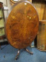 A VICTORIAN WALNUT INLAID OVAL TILT-TOP TABLE