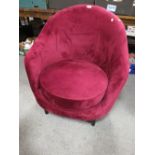 A MODERN UPHOLSTERED PURPLE CHAIR