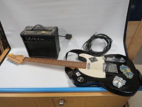 AN ENCORE BLASTER SERIES ELECTRIC GUITAR TOGETHER WITH A SMALL BB BLASTER AMPLIFIER