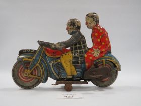 AN EARLY 20TH CENTURY METTOY CLOCKWORK TINPLATE MOTORCYCLE WITH RIDER AND PASSENGER