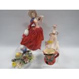 A ROYAL DOULTON FIGURINE "AUTUMN BREEZES " ETC (4)