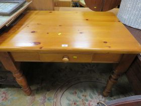 A SMALL PINE KITCHEN TABLE