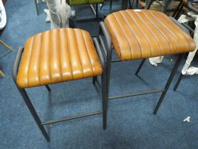 A NEAR PAIR OF TAN LEATHER KITCHEN / BAR STOOLS - NB: DIFFERENT SEAT HEIGHTS