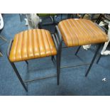 A NEAR PAIR OF TAN LEATHER KITCHEN / BAR STOOLS - NB: DIFFERENT SEAT HEIGHTS