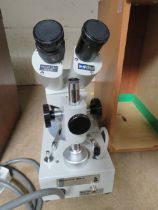 AN ELECTRIC HAMSHIRE BINOCULAR MICROSCOPE