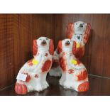 THREE STAFFORDSHIRE STYLE SPANIELS