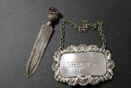 A HALLMARKED SILVER PAGE MARKER AND SILVER WINE LABEL