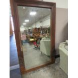 A LARGE VINTAGE WOODEN FRAMED RECTANGULAR MIRROR 198 X 121 CM