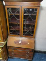 AN EDWARDIAN MAHOGANY AND INLAID BUREAU BOOKCASE