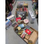 THREE TRAYS OF SUNDRIES TO INCLUDE VINTAGE PHOTO ALBUMS (EMPTY) COLLECTABLE TINS, MAPS ETC