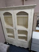 A SHABBY CHIC STYLE PAINTED CABINET WITH WIREWORK DOORS H-160 W-120 CM
