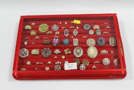 A RED DISPLAY BOX CONTAINING APPROX 70 RINGS