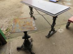 A CAST IRON TABLE AND A PEDESTAL TABLE BASE