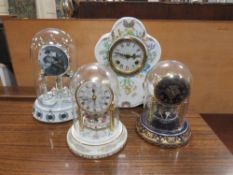 FOUR DECORATIVE MANTLE CLOCKS TO INCLUDE THREE UNDER GLASS DOMES COMPRISING AN ELVIS PRESLEY
