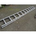 AN ALUMINIUM EXTENDING YOUNGMAN 3.37 M DOUBLE LADDER