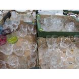 FOUR TRAYS OF ASSORTED GLASSWARE TO INCLUDE WINE GLASSES, COLOURED GLASS EXAMPLES ETC