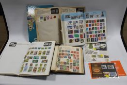FIVE STAMP ALBUMS AND FOUR PRESENTATION PACKS, OLD ALBUM TO INCLUDE 9 PENNY RED VICTORIAN STAMPS