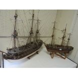 A VINTAGE SCRATCH BUILT MODEL OF A GALLEON TOGETHER WITH A LARGER EXAMPLE