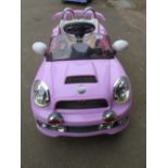 A CHILDS BATTERY RIDE ON CAR LILAC SPORTS MINI - (MISSING CHARGER)