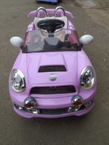 A CHILDS BATTERY RIDE ON CAR LILAC SPORTS MINI - (MISSING CHARGER)