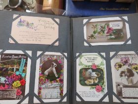 A TRAY CONTAINING POSTCARD ALBUMS, CIGARETTE CARDS ETC TO INCLUDE A SMALL ALBUM OF ASSORTED