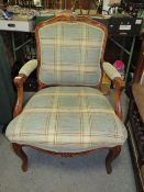 A FRENCH STYLE UPHOLSTERED ARMCHAIR