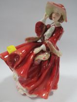A ROYAL DOULTON FIGURINE "TOP O THE HILL"