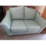 A TWO SEATER SPRUNG EDGE FABRIC SOFA