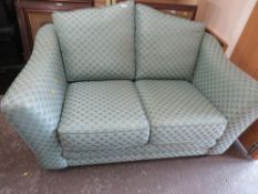 A TWO SEATER SPRUNG EDGE FABRIC SOFA