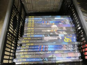 A TRAY CONTAINING TWENTY STAR TREK GRAPHIC NOVEL COLLECTION BOOKS, STILL FACTORY WRAPPED