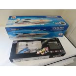 A BOXED RADIO CONTROL HIGH SPEED RACING BOAT PLUS A BOXED RADIO CONTROLLED HELICOPTER (2)