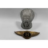 A REPRODUCTION GUY MOTORS LTD NATIVE AMERICAN INDIAN TOGETHER WITH A MODERN BRASS BENTLEY BADGE WITH