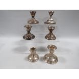 SIX ASSORTED HALLMARKED SILVER SQUAT CANDLESTICKS VARIOUS DATES AND MAKERS A/F