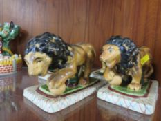 FOUR REPRODUCTION STAFFORDSHIRE STYLE LIONS