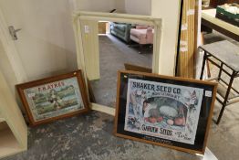 A LARGE CREAM MIRROR TOGETHER WITH TWO FRAMED ADVERTISING PRINTS (3)