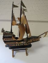 A SCRATCH BUILT MODEL OF A GALLEON ON STAND