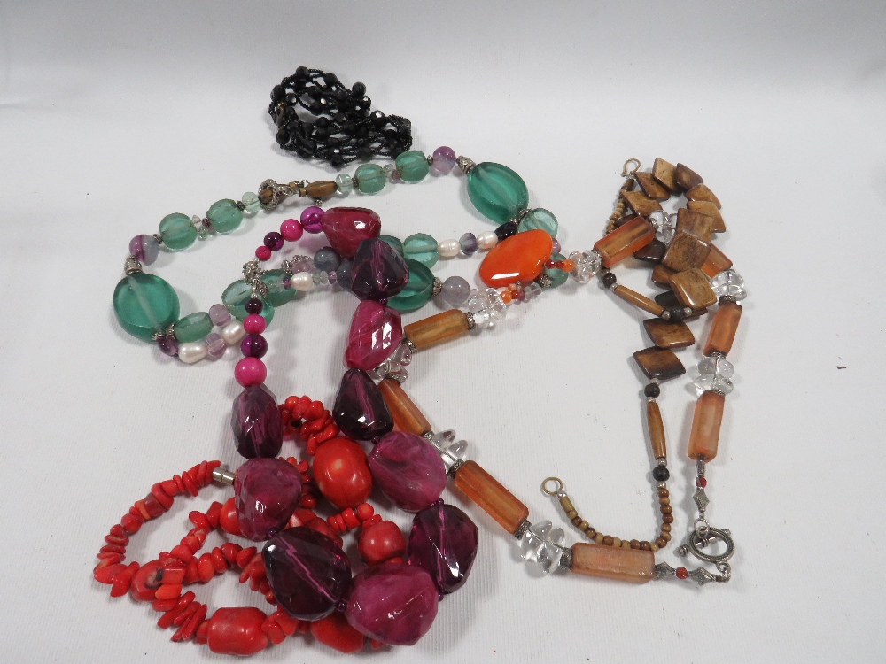 A BAG OF COSTUME JEWELLERY