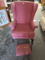 A QUEEN ANNE STYLE WINGED BACK CHAIR AND STOOL