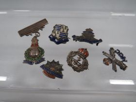 SIX SILVER AND ENAMEL MILITARY BADGES