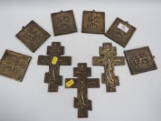 A COLLECTION OF SIX ROUGH CAST BRASS ORTHODOX CRUCIFIXES AND ST GEORGE PLAQUE, MADE FOR THE